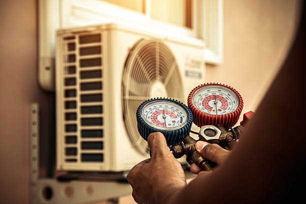 Professional Air Conditioning Service technician working in Darien Center, NY